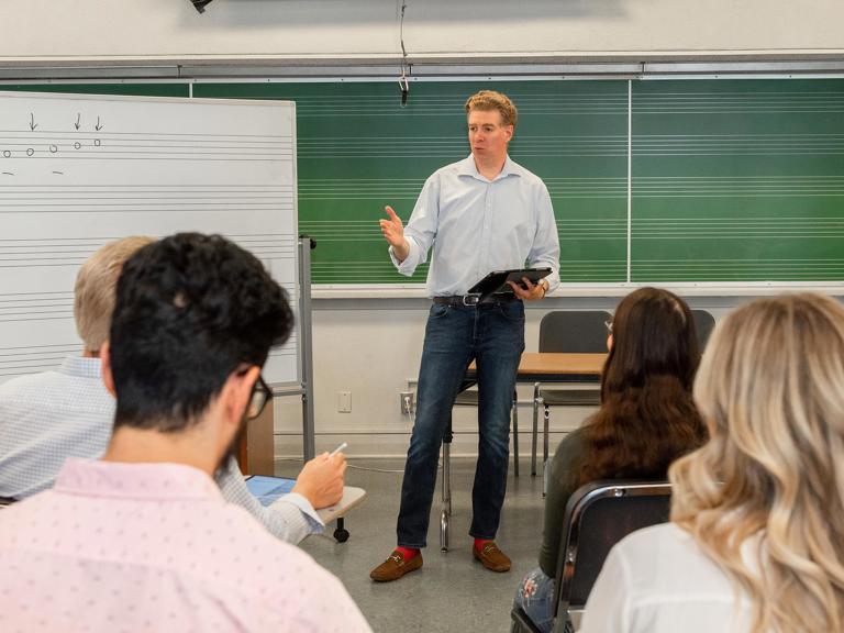 Music professor teaching music class at the Kodály Center.