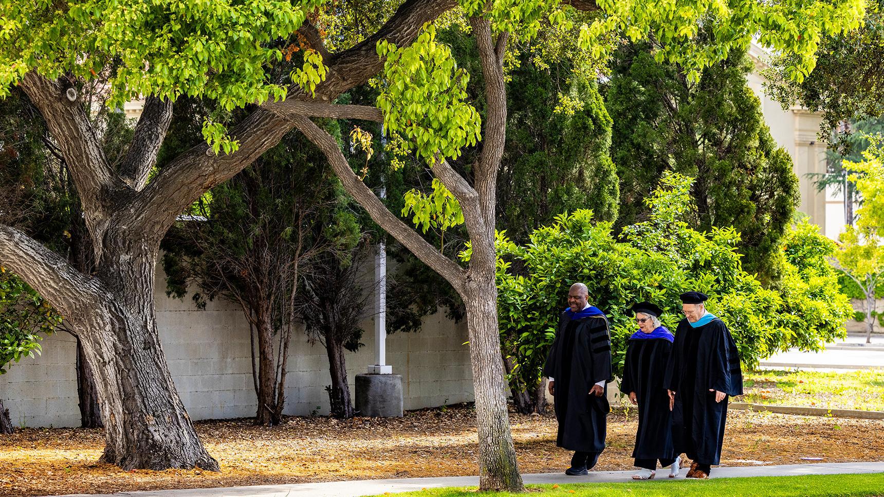 Program media masthead - school of education faculty walking