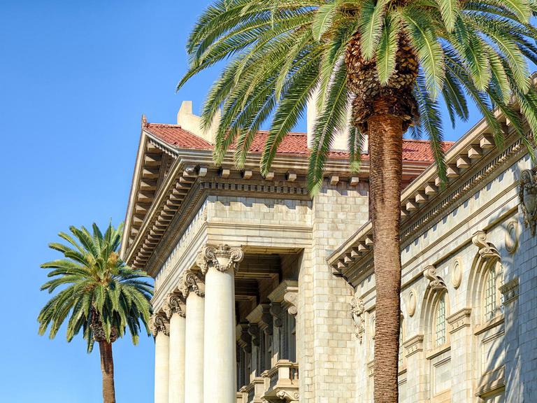 Side shot of the University of Redlands administration building during the day.