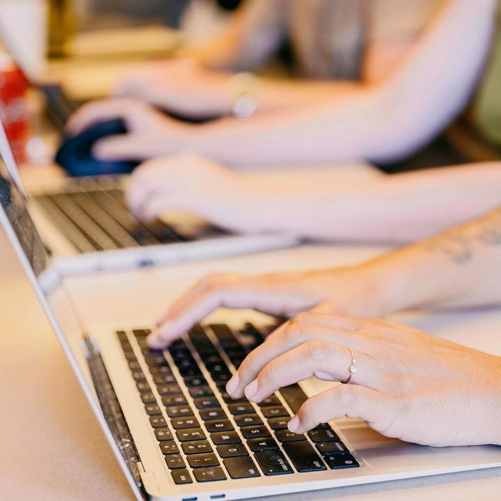 Media card - student typing on computer