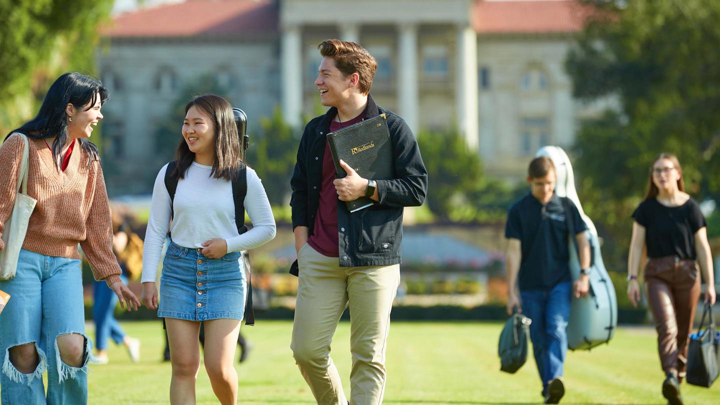 Media masthead - Music students walking in front of admin building