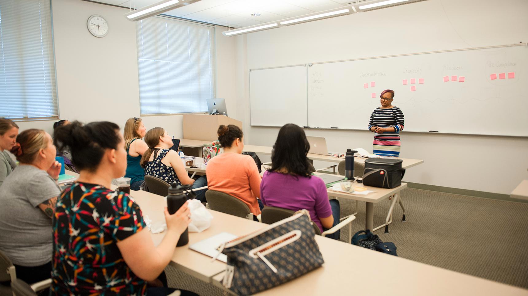 Program media masthead - Professor teaching graduate students