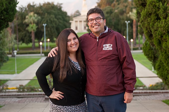 Counseling students Omar and Beatriz stand together on the U of R campus.