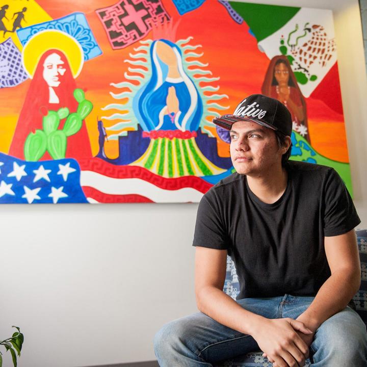 Mutiple media - Native student sitting in Native student programs office