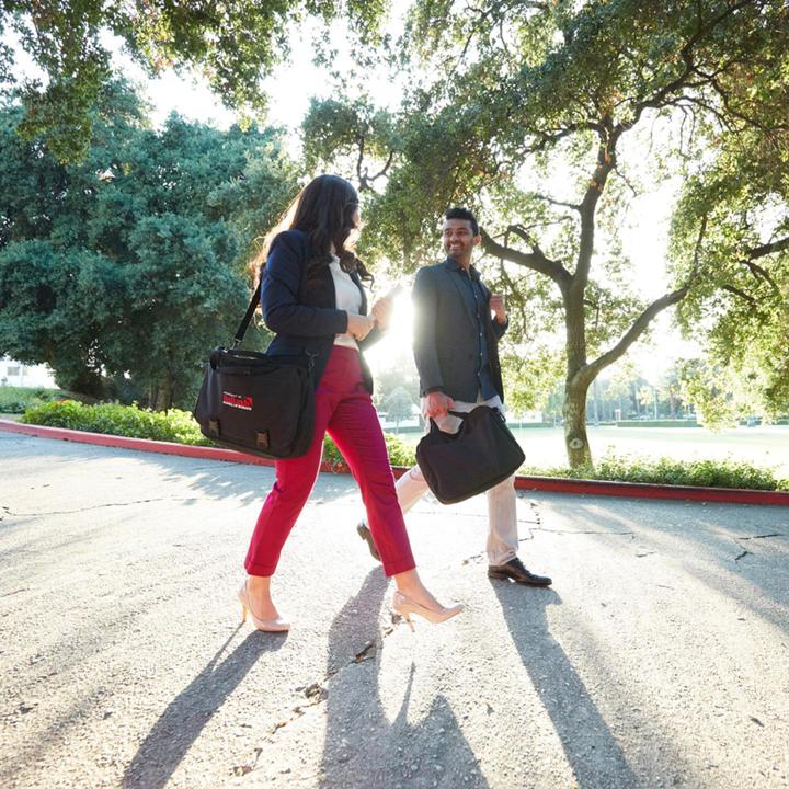 Mutiple media - Graduate business MBA students walking