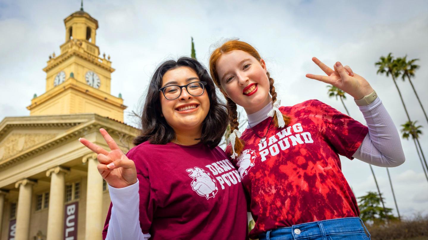 Two newly admitted UofR students smiling for a photo.