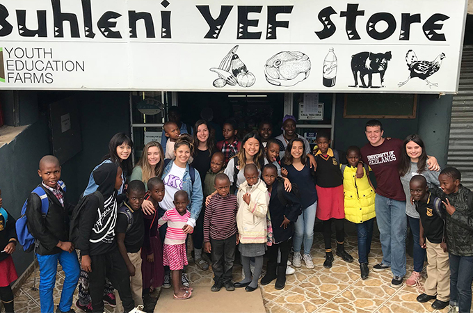 Redlands team with Swazi children near a Hospital they rebuilt