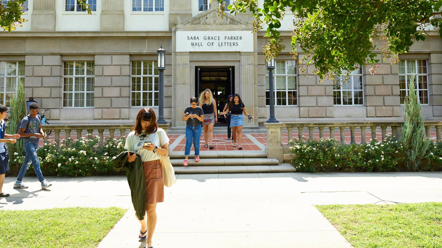 Media masthead - College of liberal arts and sciences students walking to class