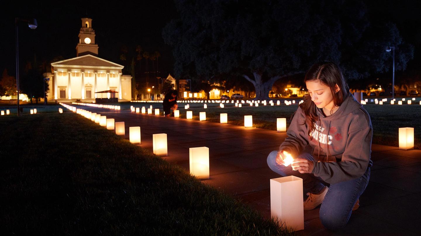 Media masthead - Feast of Lights luminary student lighting candle