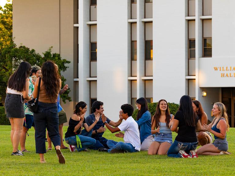 Image card - First-year students on grass