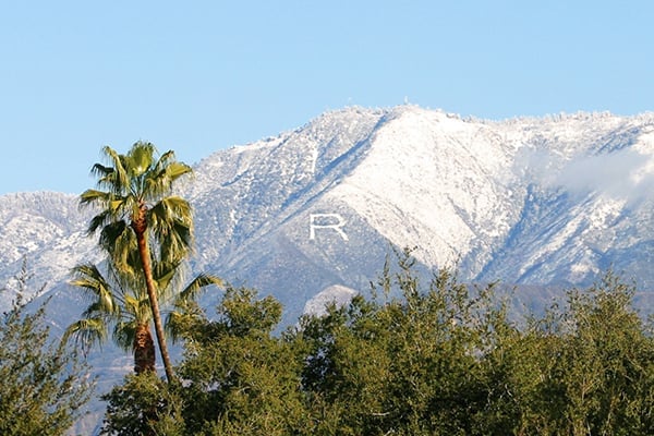 A letter R is formed into a mountainside