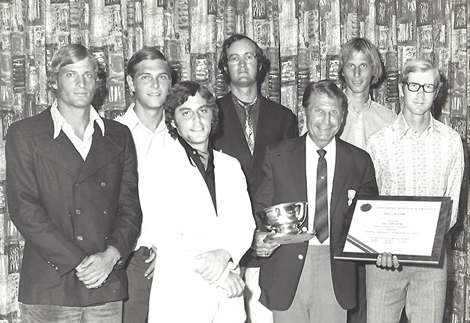men standing in a group winning an award