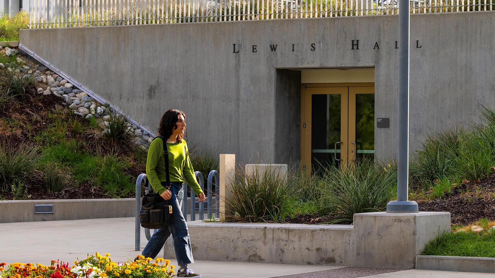 Program media masthead - GIS student walking past Lewis Hall