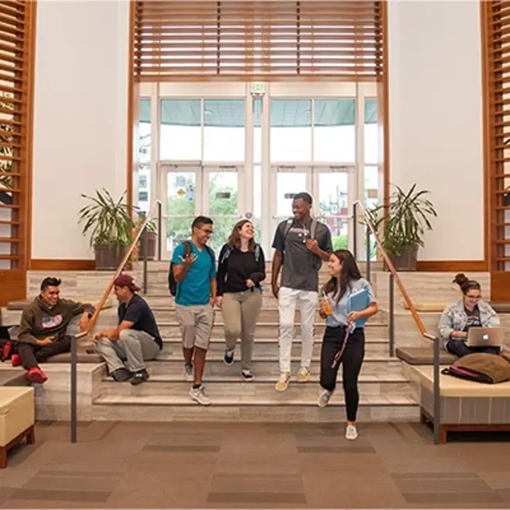 students-walking-through-library